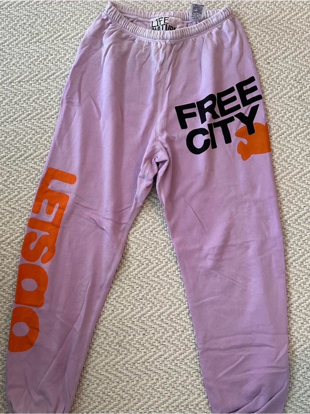 freecity Lilac Track Joggers with Black and Orange Graphics